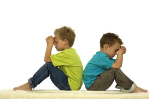 boys praying back to back