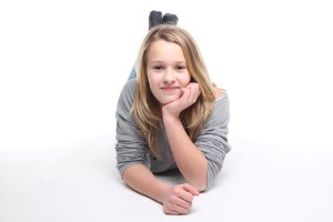 teen laying down and looking ahead